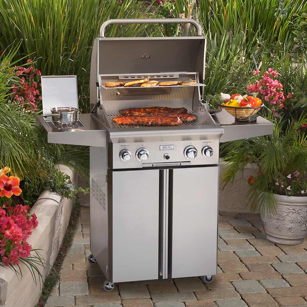Stainless steel gas grill with lid open showing cooking grates and control panel