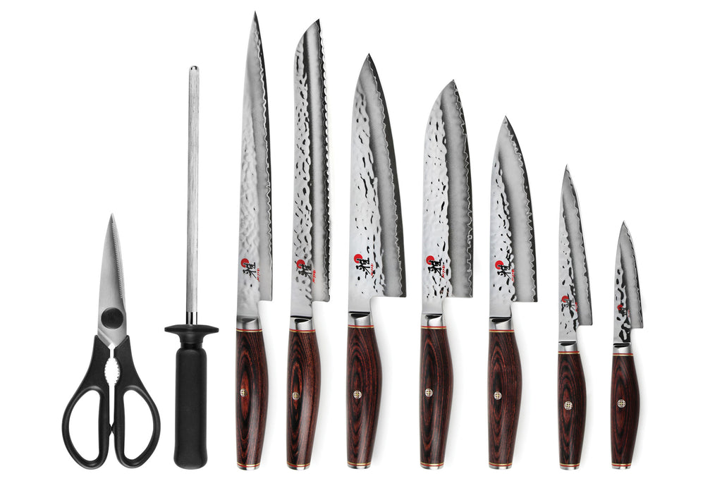 Knife set with multiple stainless blades and dark wood handles, plus shears