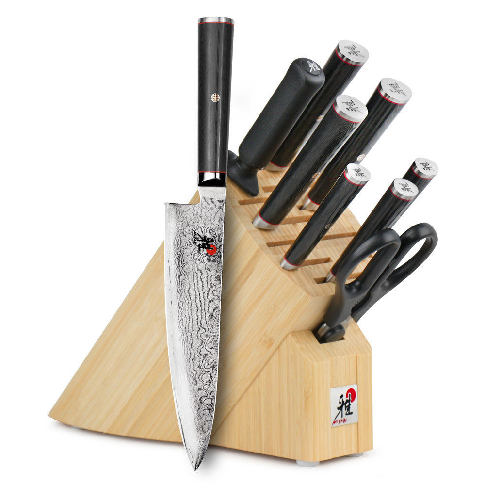 10-piece knife set with black handles in light wood block
