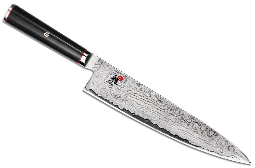 Damascus-style chef's knife with black handle and red accents