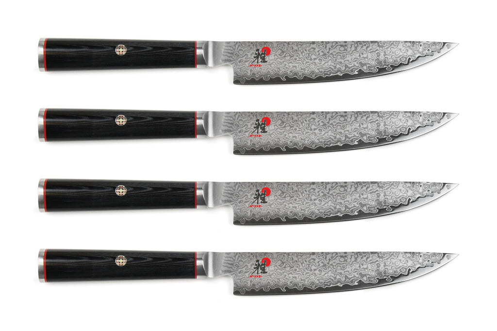 Miyabi Kaizen steak knife set, four damascus-style blades with black handles