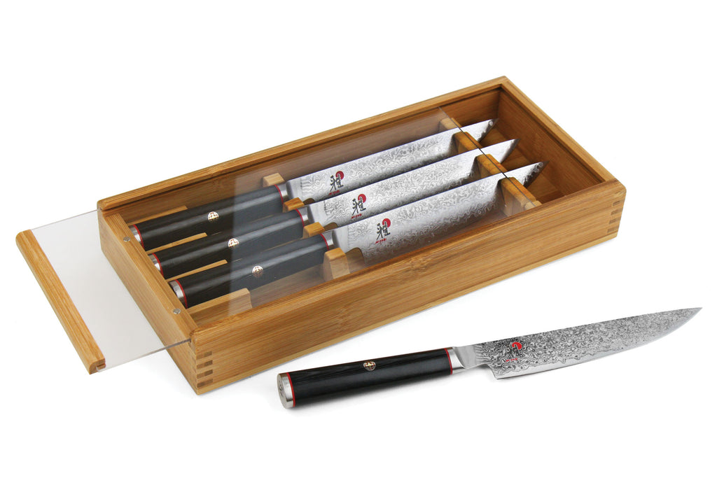 Miyabi Kaizen steak knife set in wooden box, four knives with black handles