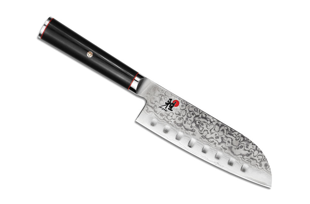 Black-handled santoku knife with silver blade and red accent ring at bolster