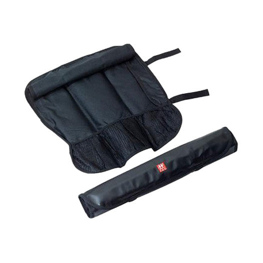 Knife roll pouch with multiple interior pockets and dark fabric straps, small red badge