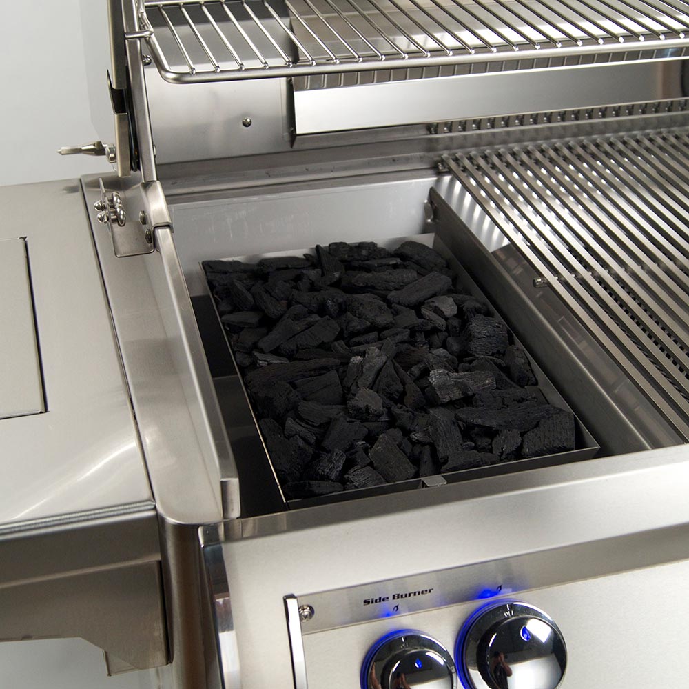 Fire Magic charcoal smoker basket filled with charcoal briquettes in metal tray