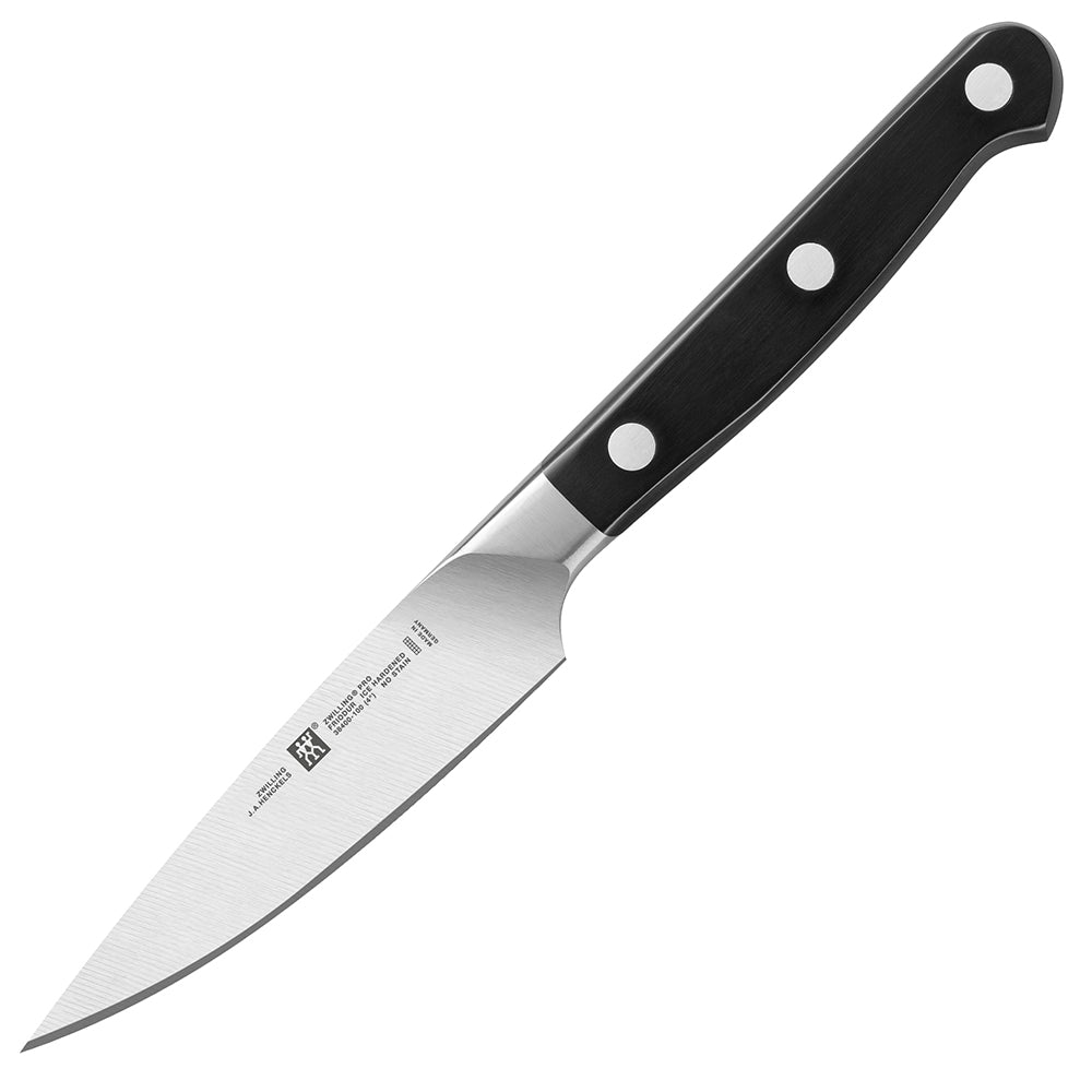 Zwilling J.A. Henckels Pro 4-inch paring knife, dark handle with rivets, stainless blade.