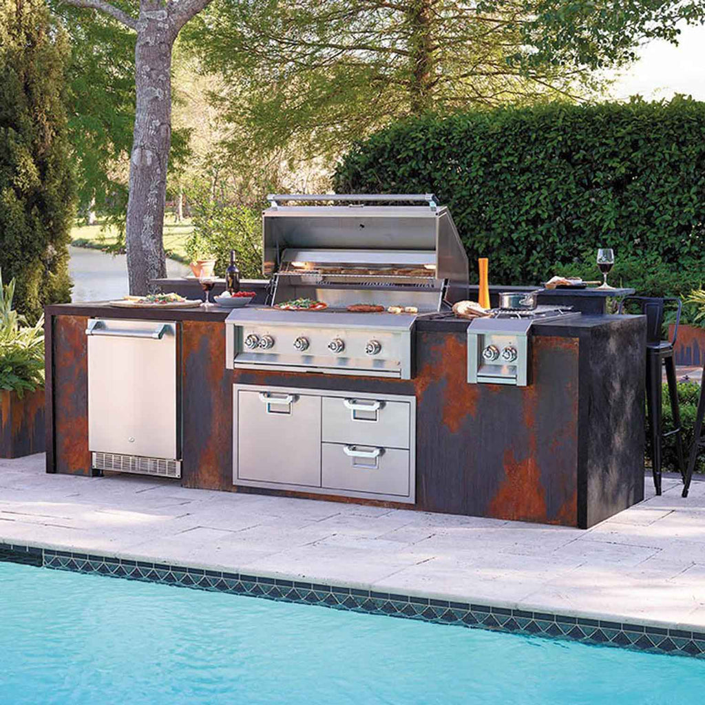 Built-in gas grill with stainless lid, front control knobs, and side cabinet compartments