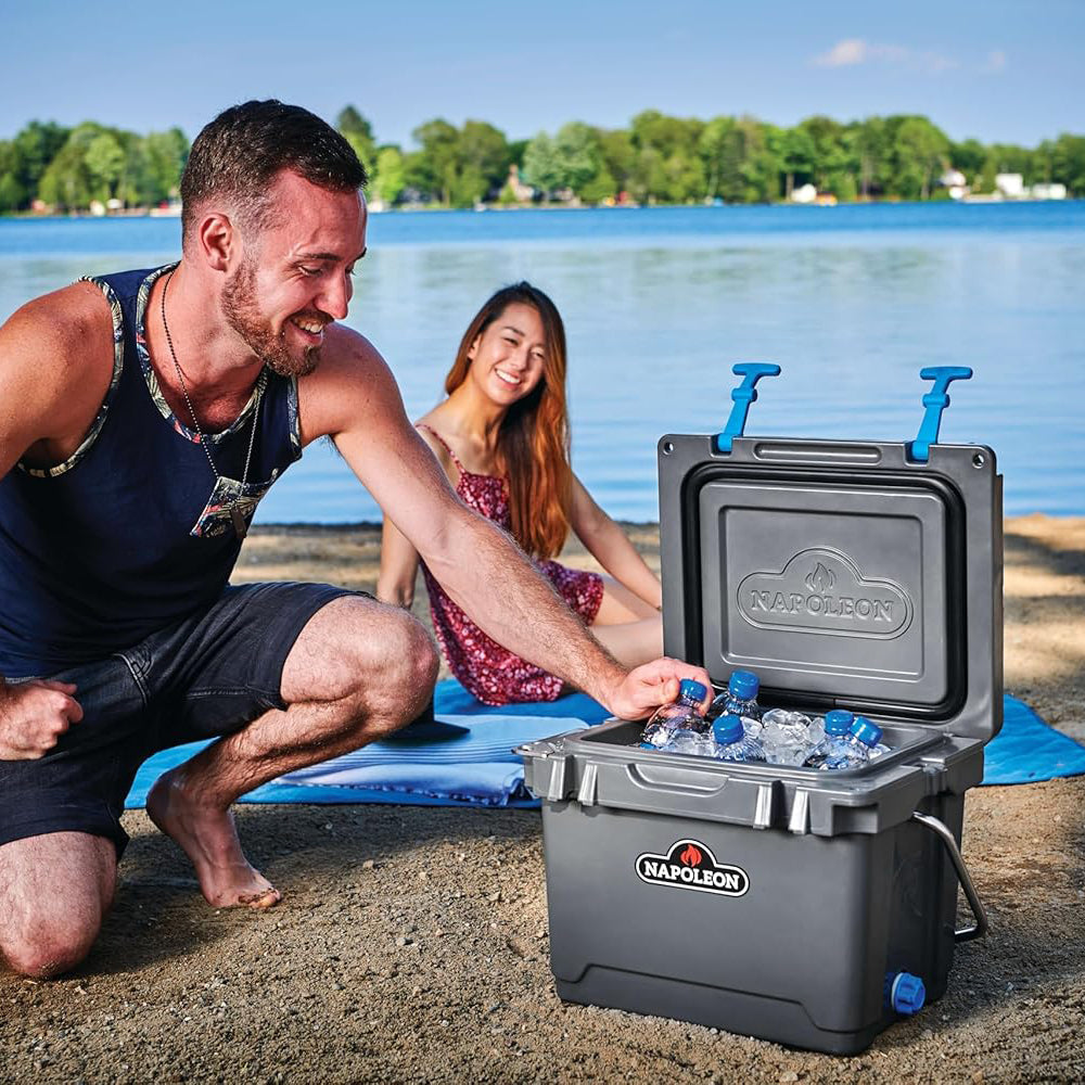 Cooler chest open with ice and blue-capped bottles, gray body and blue handles