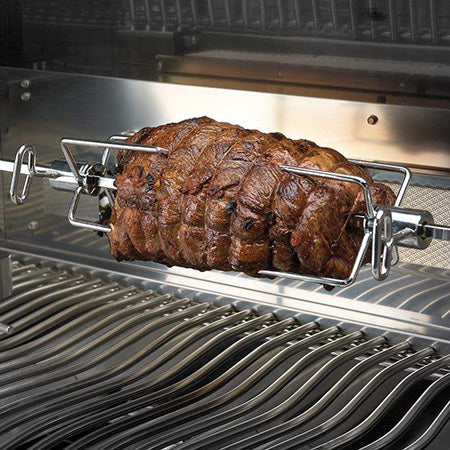 Rotisserie forks holding a roast on a metal spit