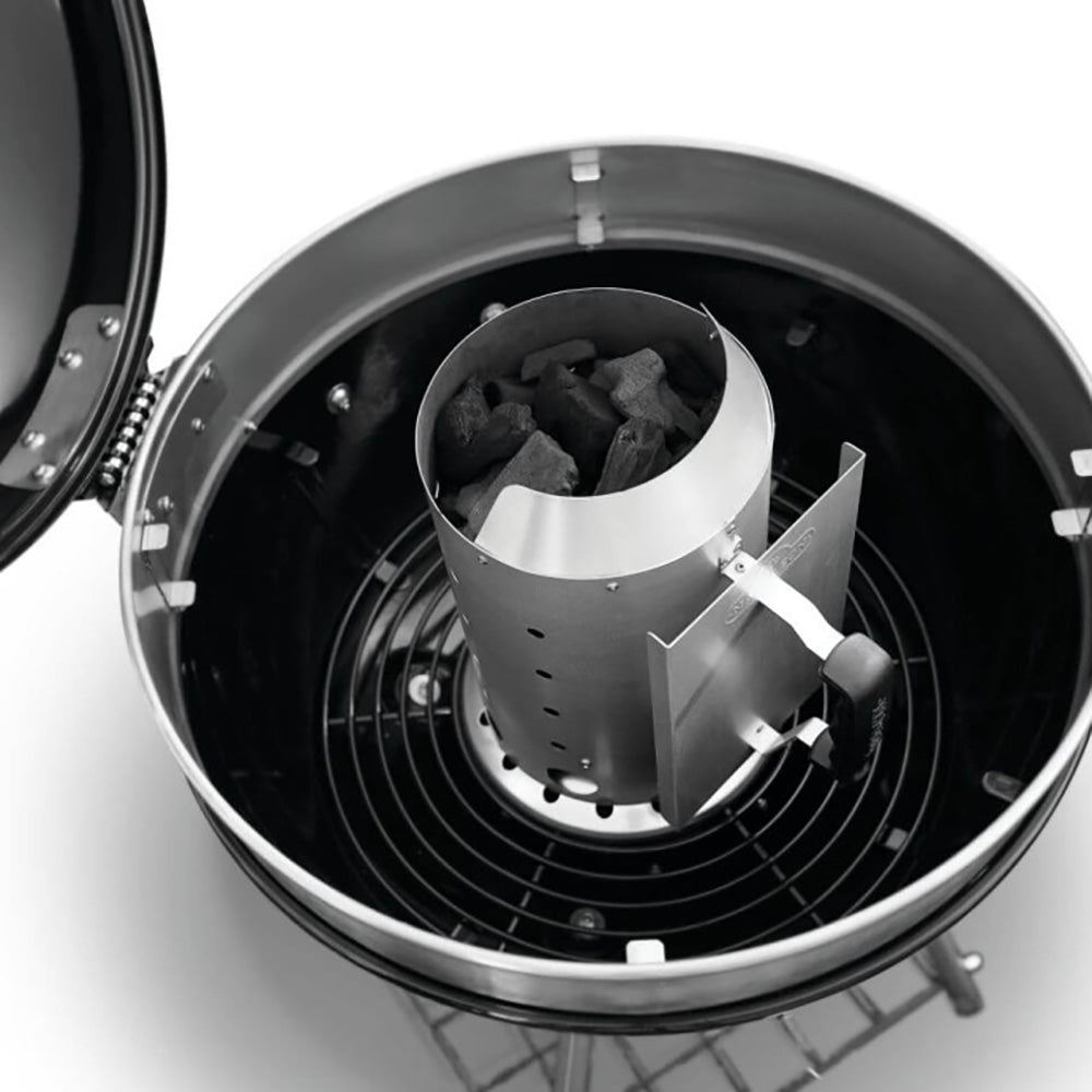 Round charcoal starter insert holding charcoal pieces with vented metal walls