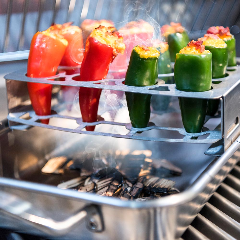 Stainless steel double pepper roaster rack with hot stuffed peppers and smoke