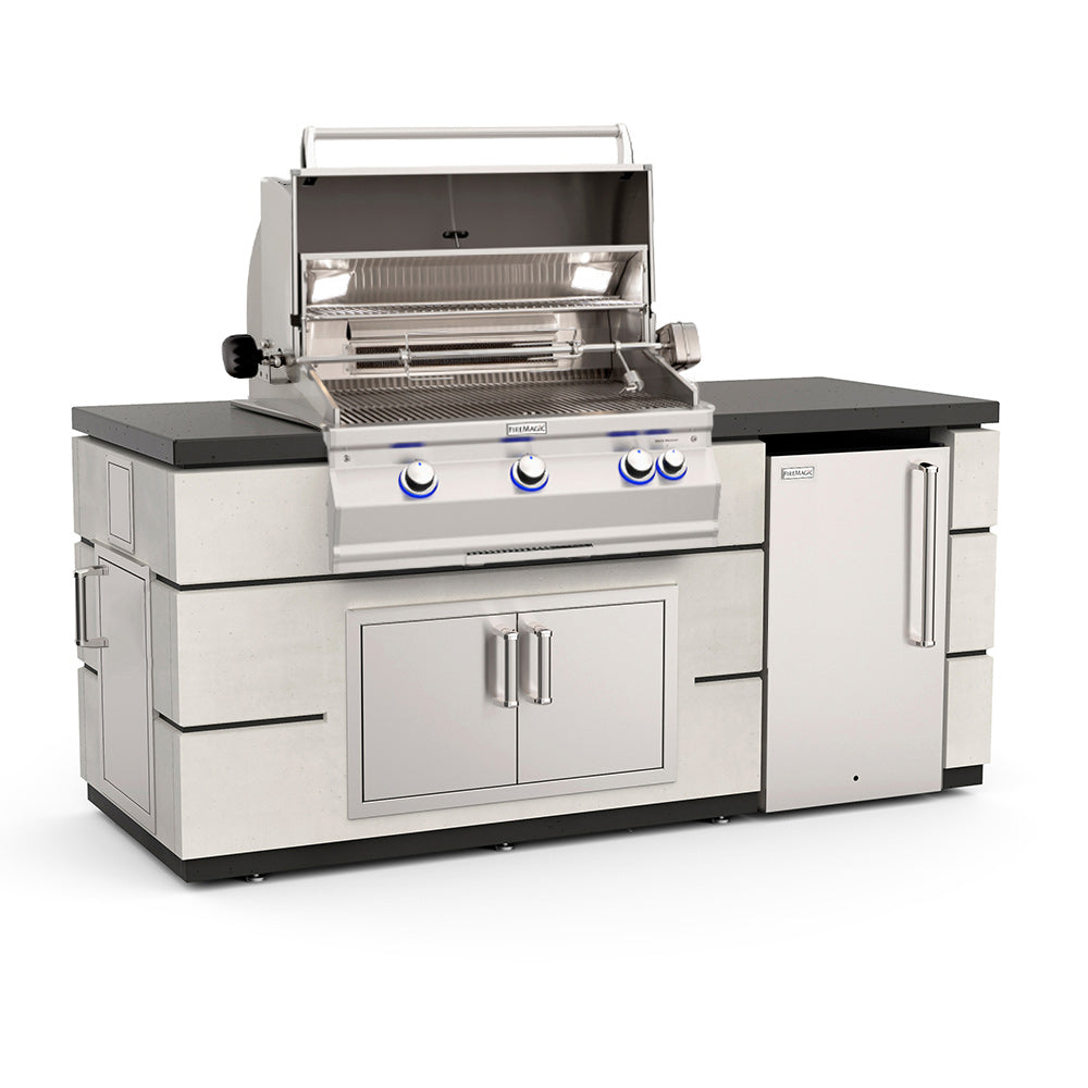 Outdoor kitchen island with built-in gas grill, refrigerator doors, and storage cabinet