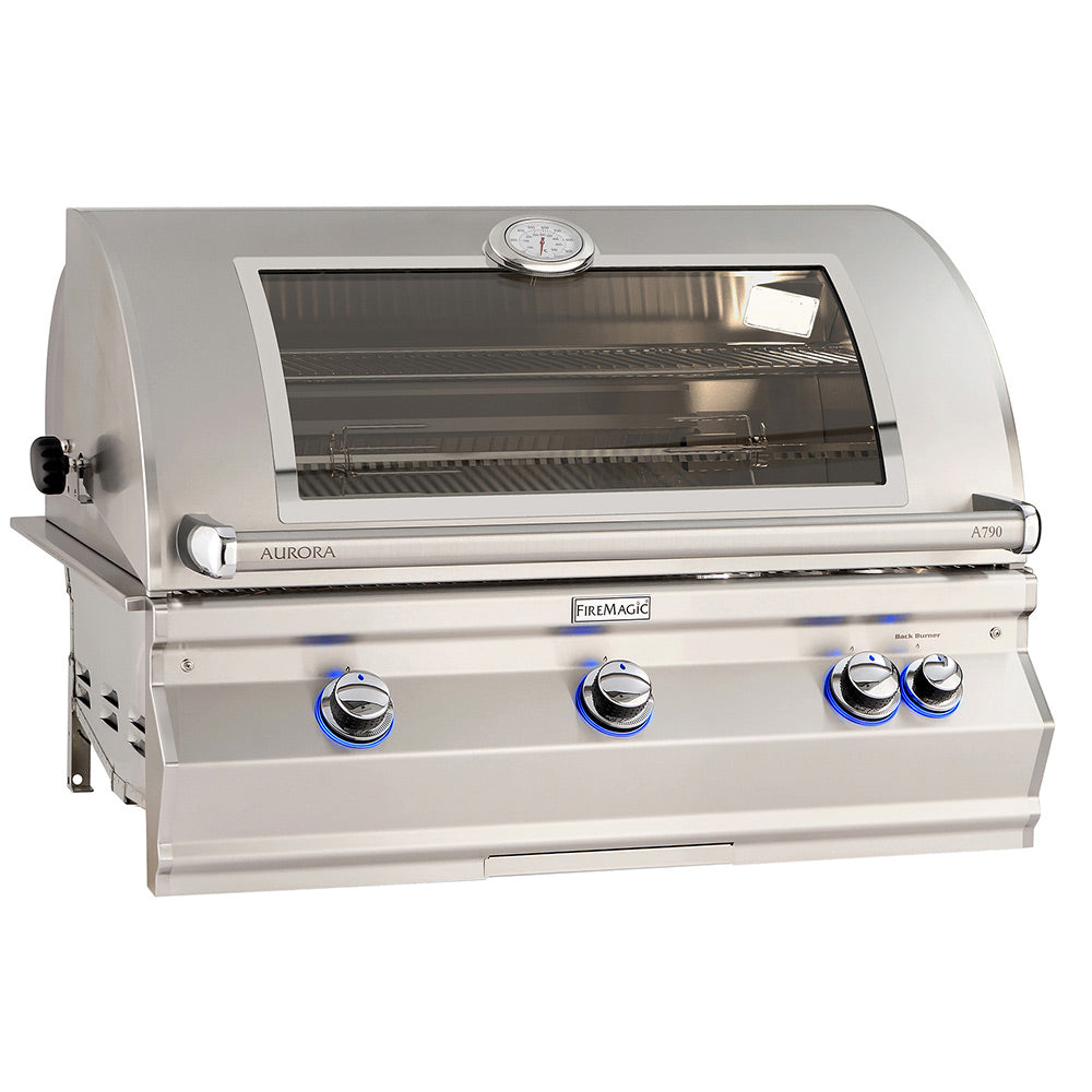 Stainless steel built-in gas grill with open hood, interior grate, and blue knobs