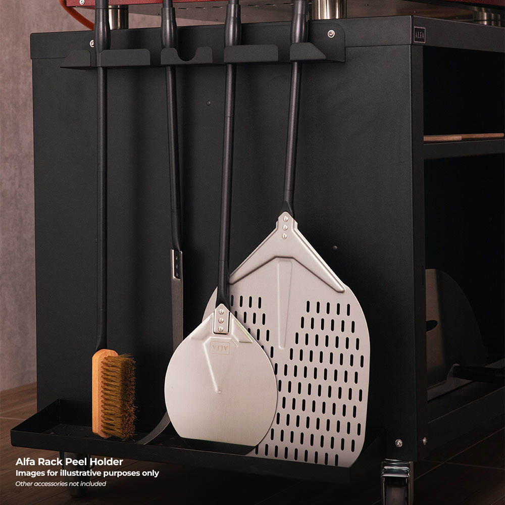 Black rack with two white perforated peel tools and wooden brush