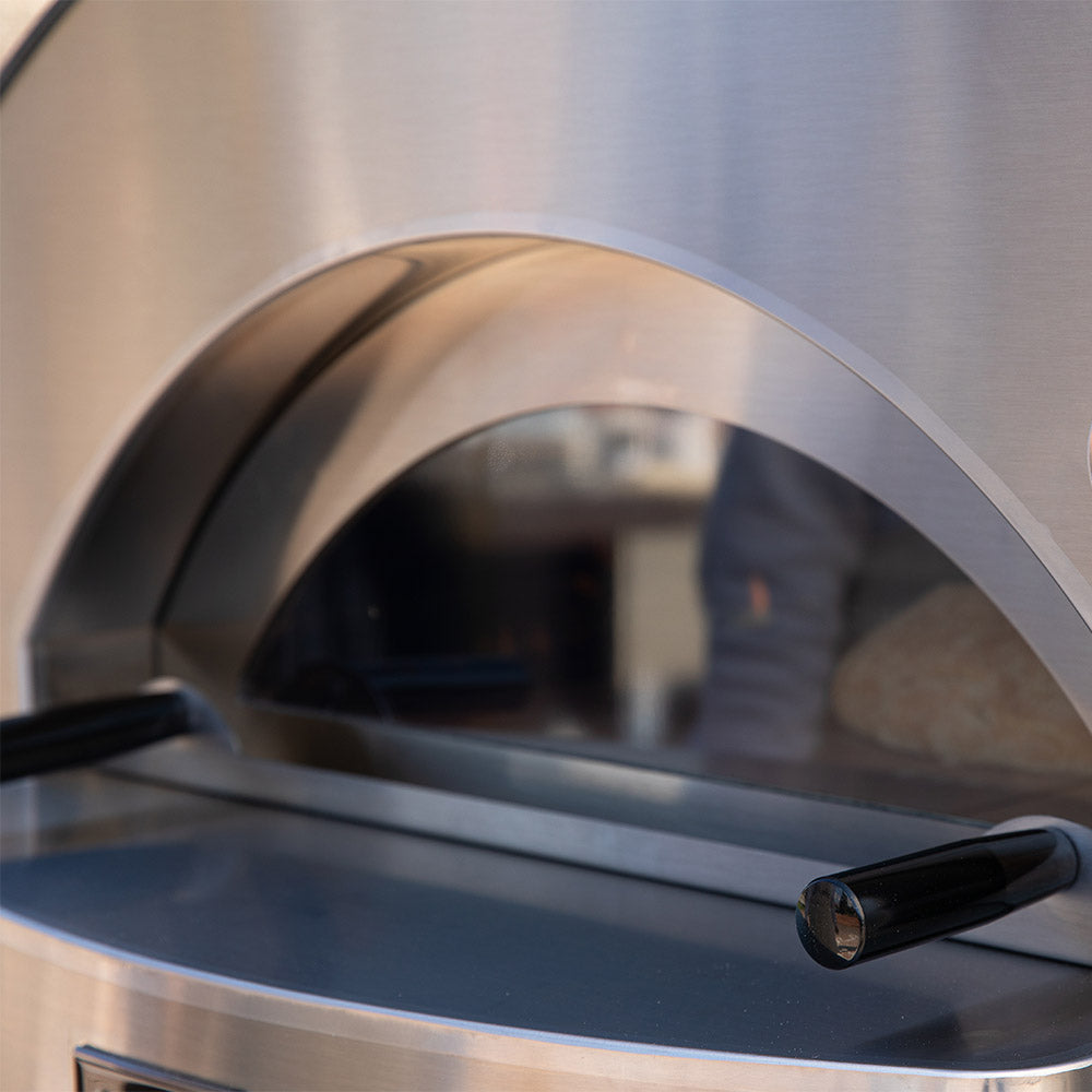 Stainless steel oven dome interior with arched opening and black door handle