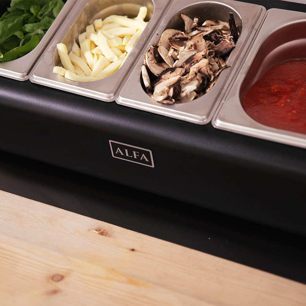 Alfa topping station close-up with four filled stainless wells and red sauce