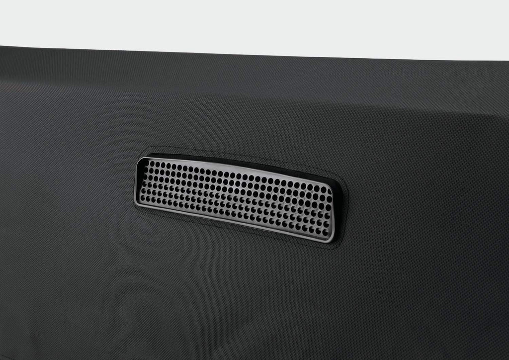 Perforated vent panel on dark vinyl grill cover