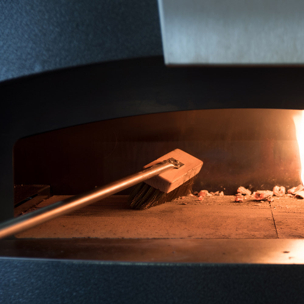 Pizza oven wood-handled peel with metal blade and fire