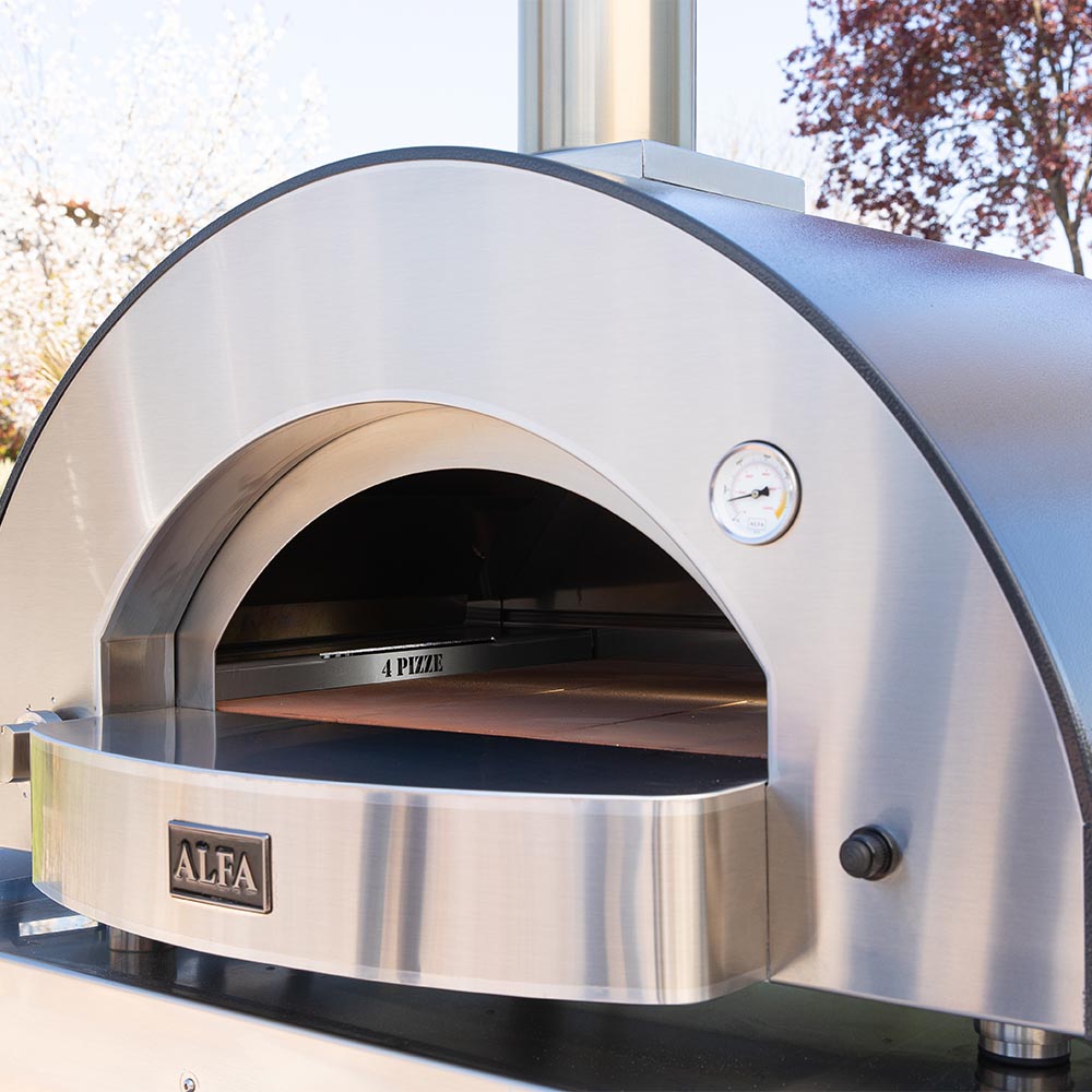 Stainless outdoor pizza oven with arched entrance and round temperature gauge on front