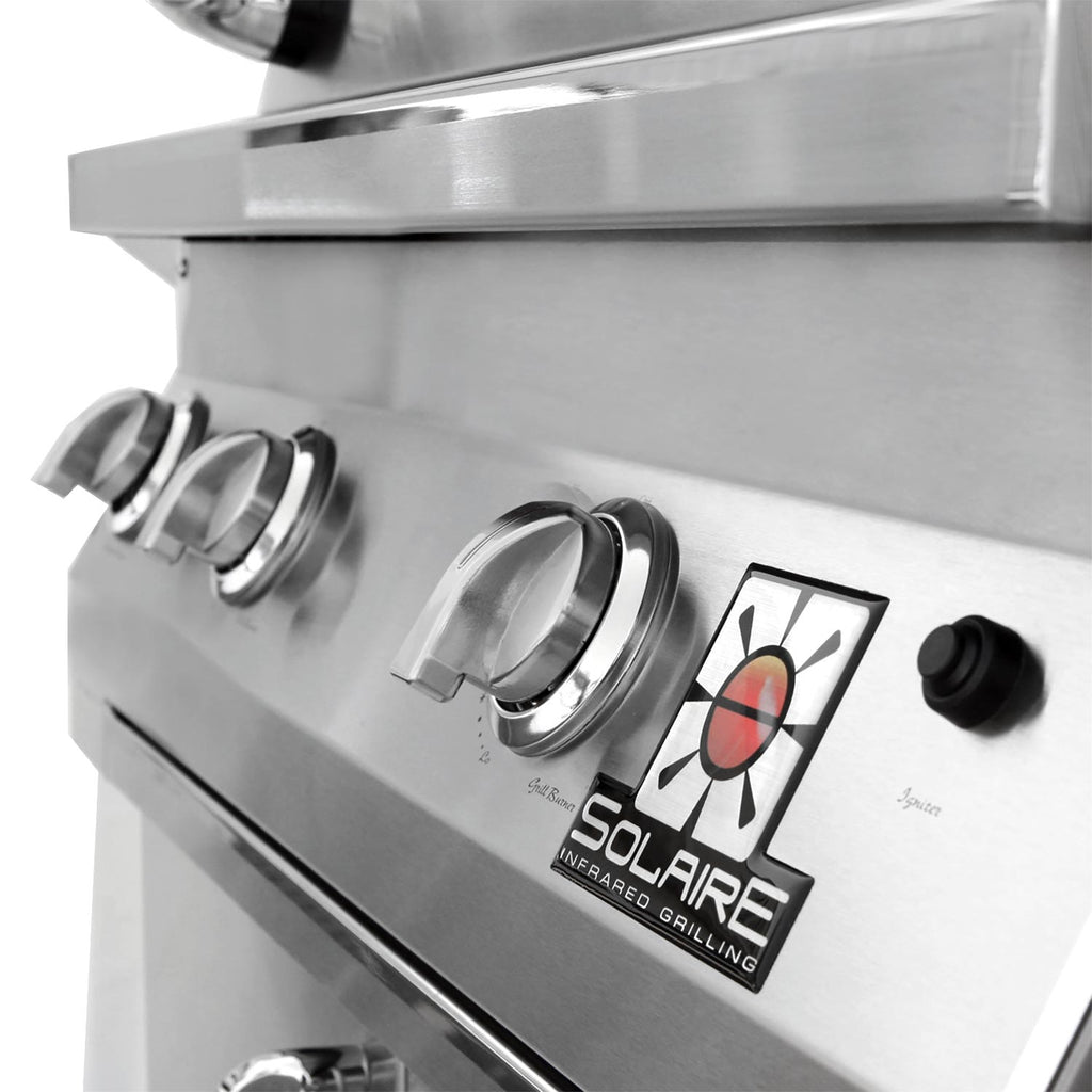 Gas grill control panel with stainless knobs and heat-mode label