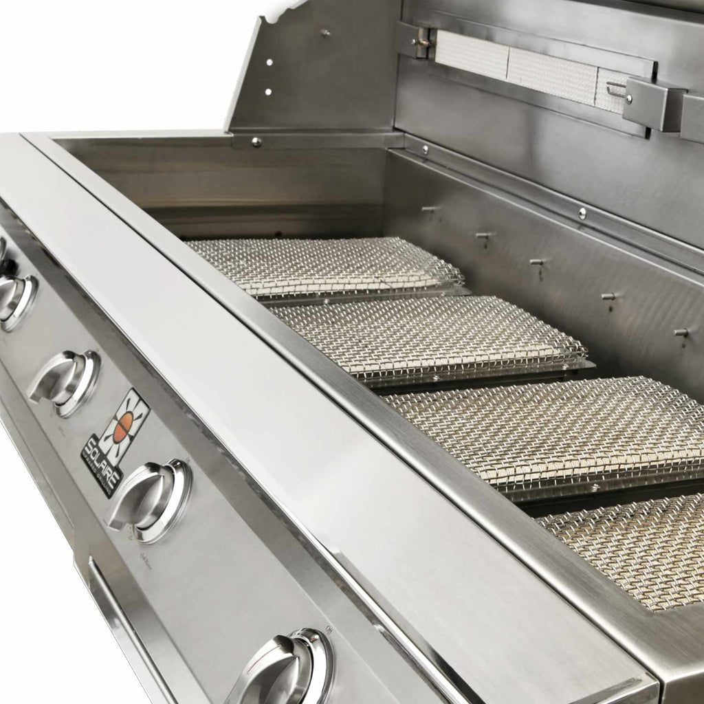 Stainless grill with side access, mesh cooking baskets and slotted grates