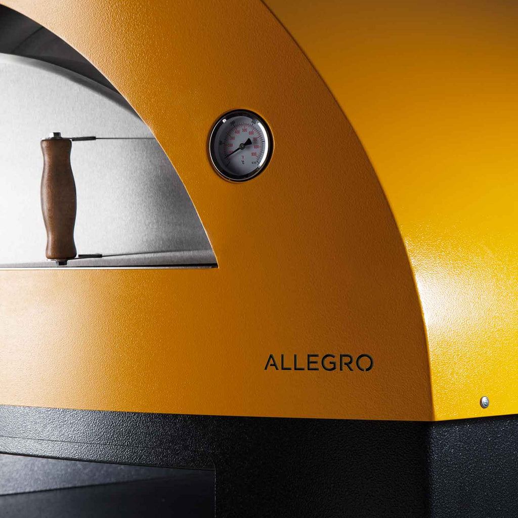 Yellow oven front panel with round gauge and arched cooking chamber
