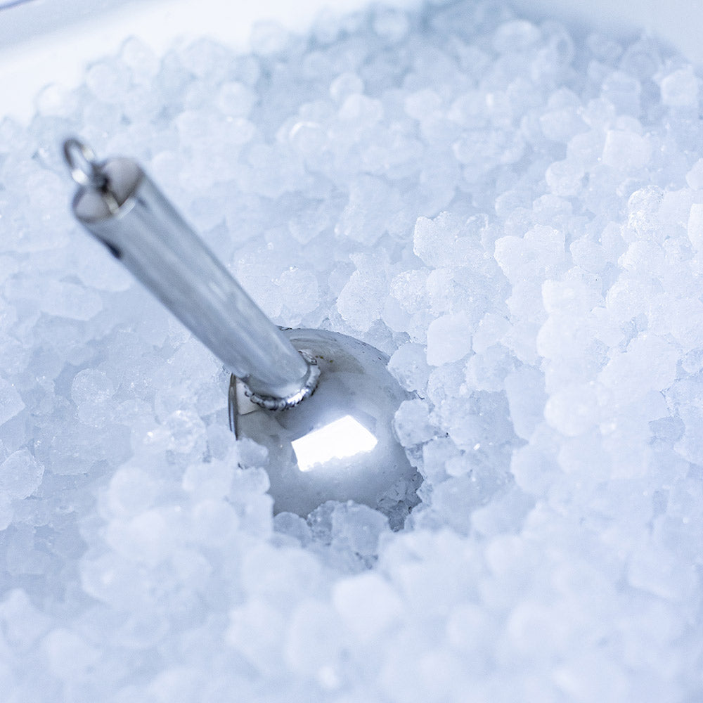 Nugget ice chute releasing ice into the bin