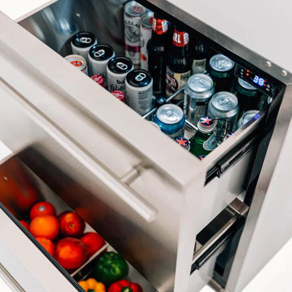 Side view of open two-drawer fridge, showing beverages and fruit inside the drawer