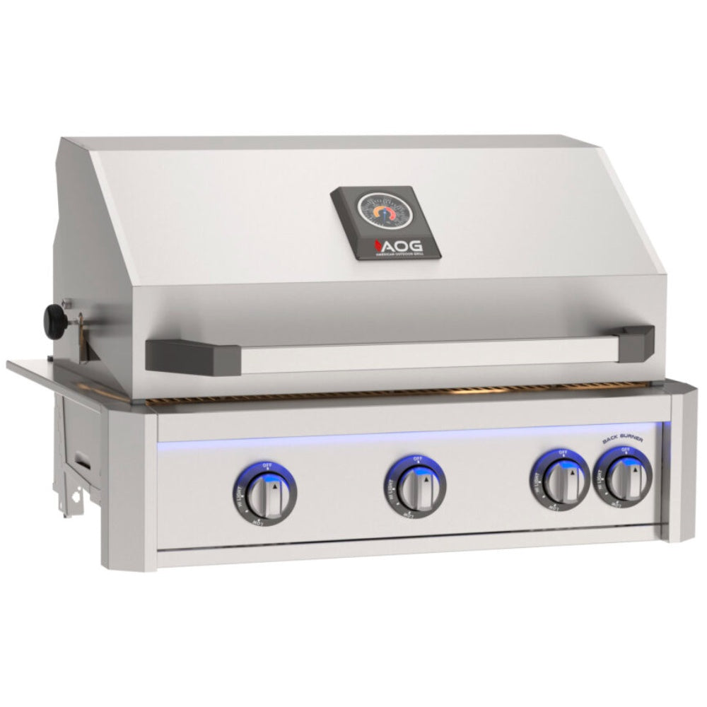 Built-in stainless gas grill with black control knobs and warming hood insert