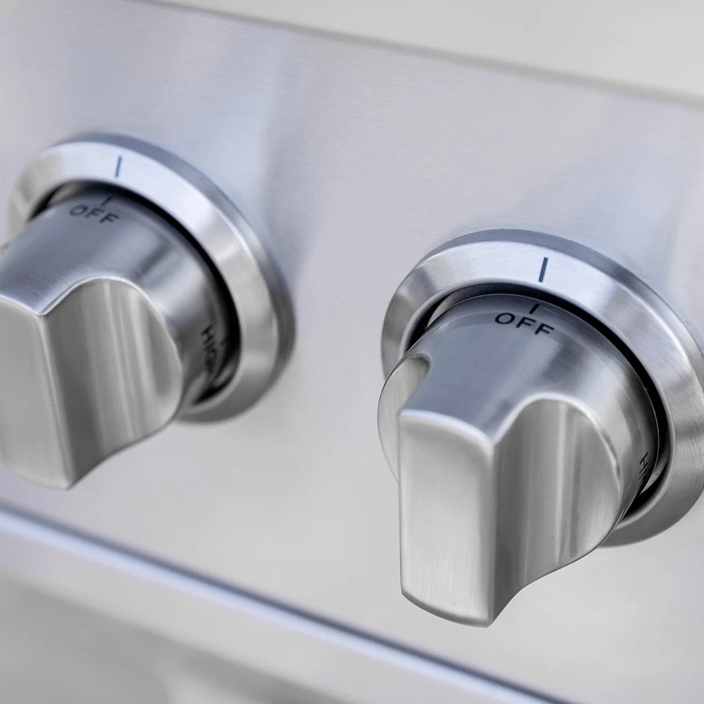 Stainless steel control knobs with OFF marks and flame indicators for side burners