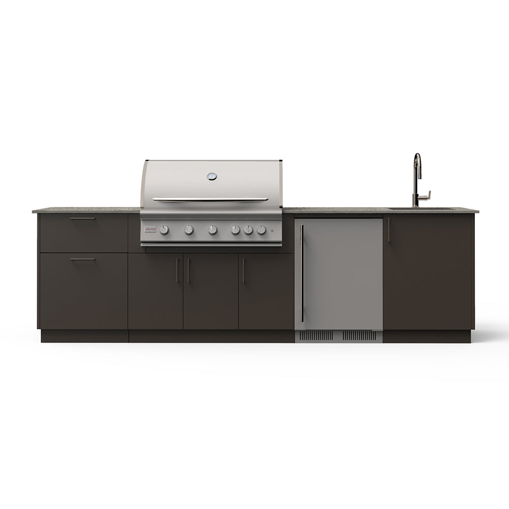 Outdoor kitchen island with grill and sink, dark cabinetry, and light countertop