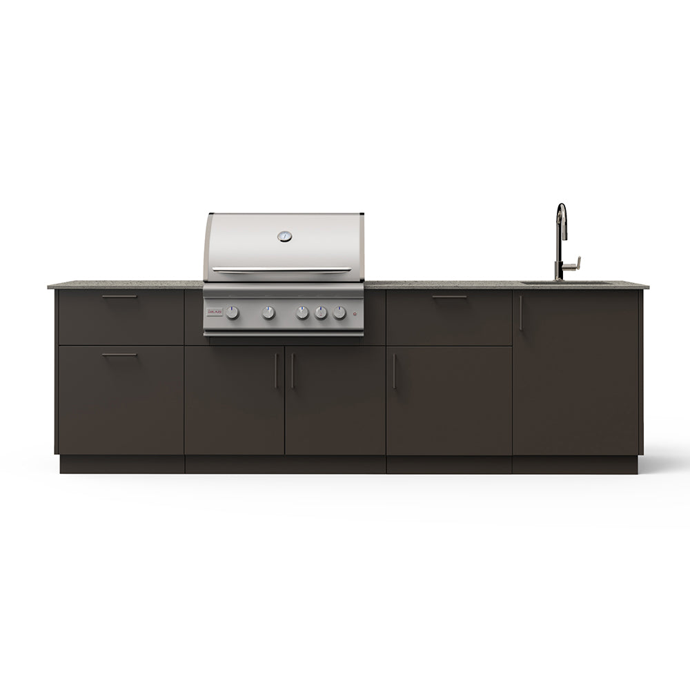 Outdoor kitchen island with stainless grill, sink faucet, and dark gray storage cabinet doors