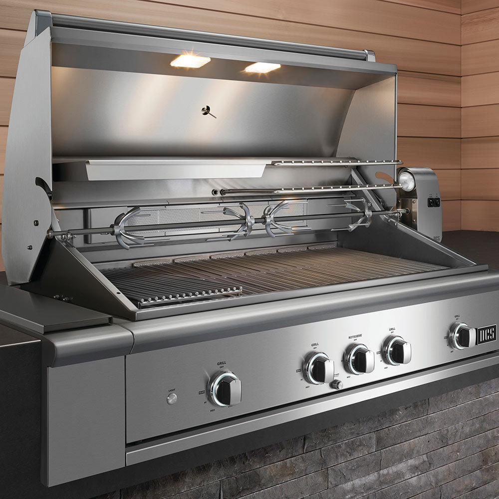 Stainless steel gas grill with open hood showing grill grates and rotisserie rod
