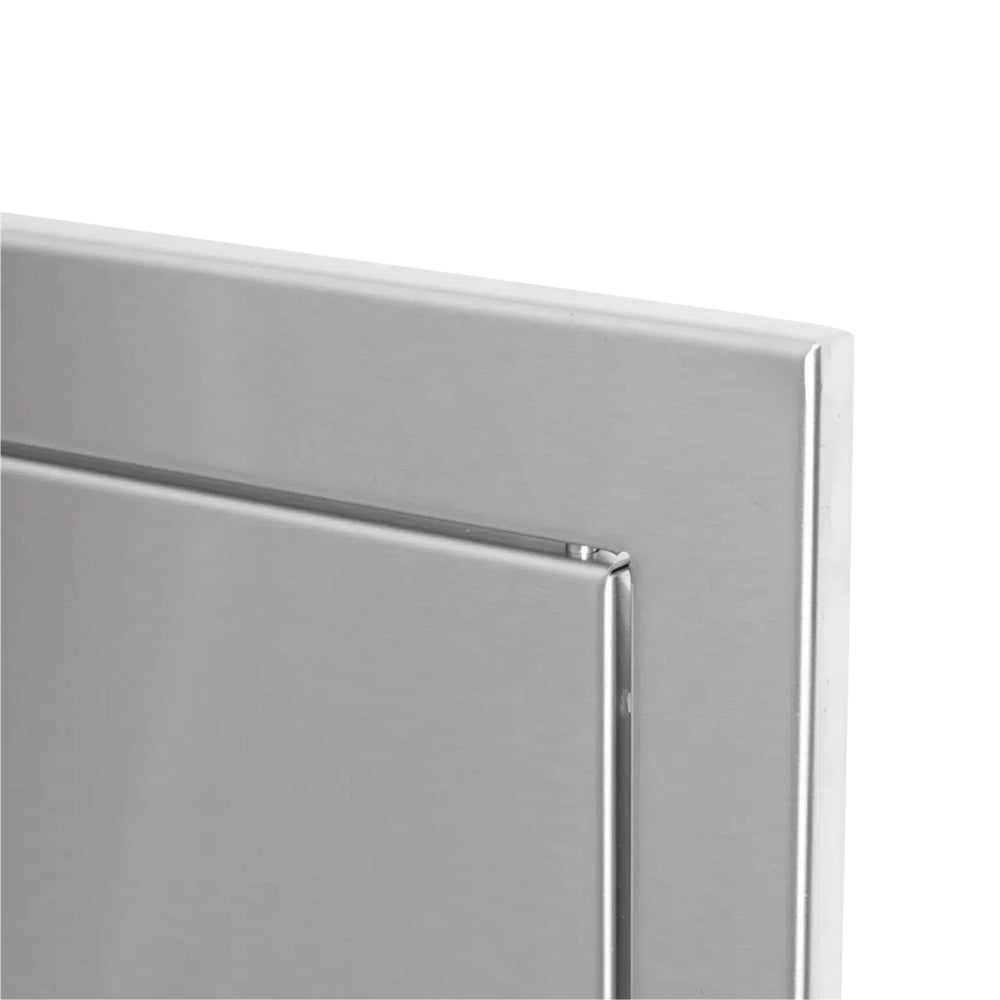 Metal drawer frame corner with recessed edge detail and close seam