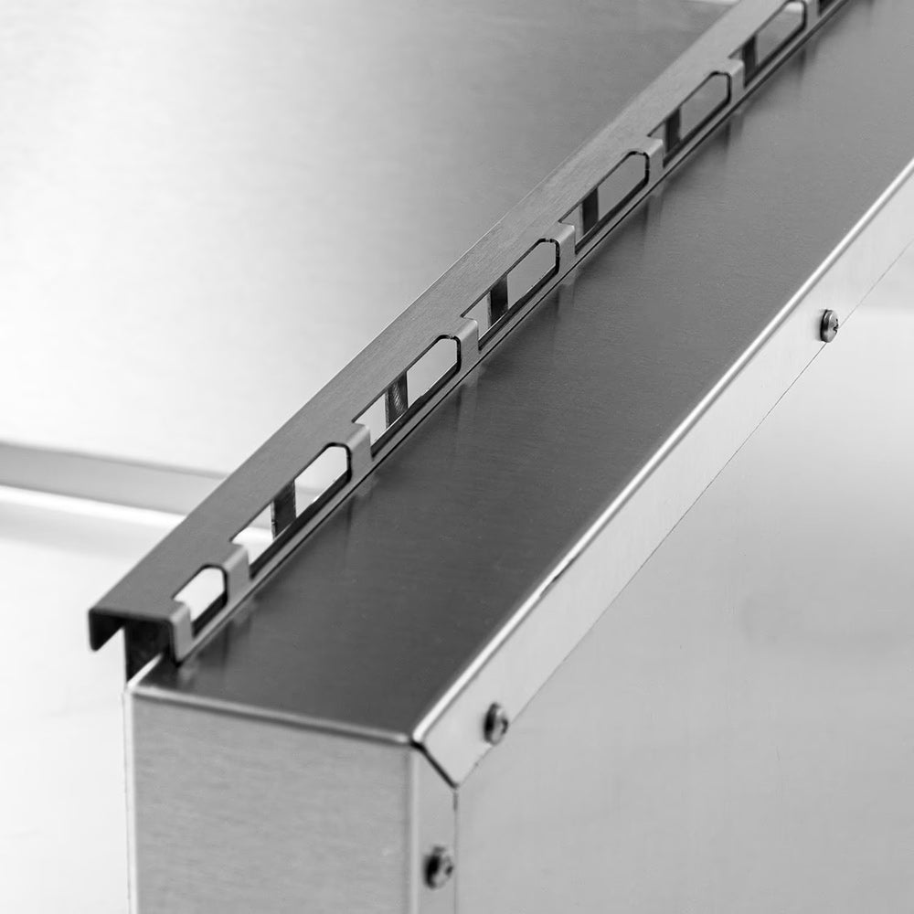 Stainless steel top rail with black latch handles and evenly spaced slots