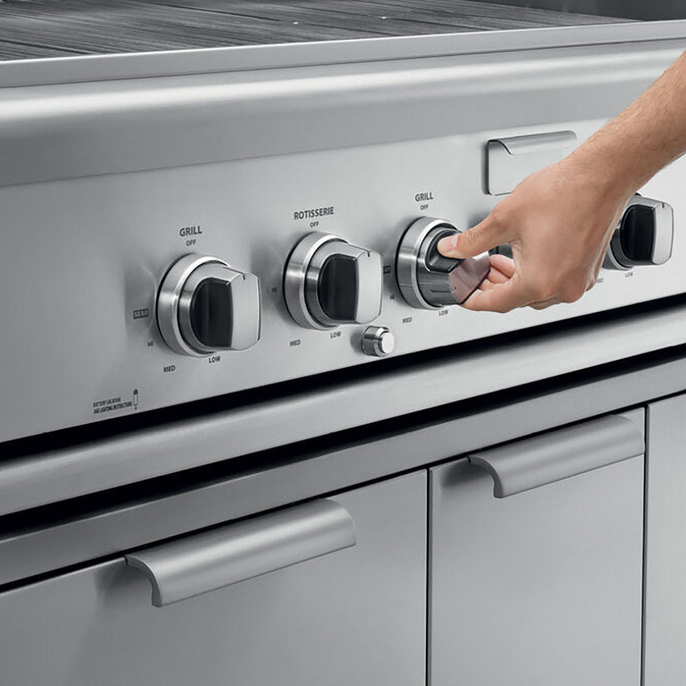 Built-in gas grill control panel close-up with knobs and rotisserie handle