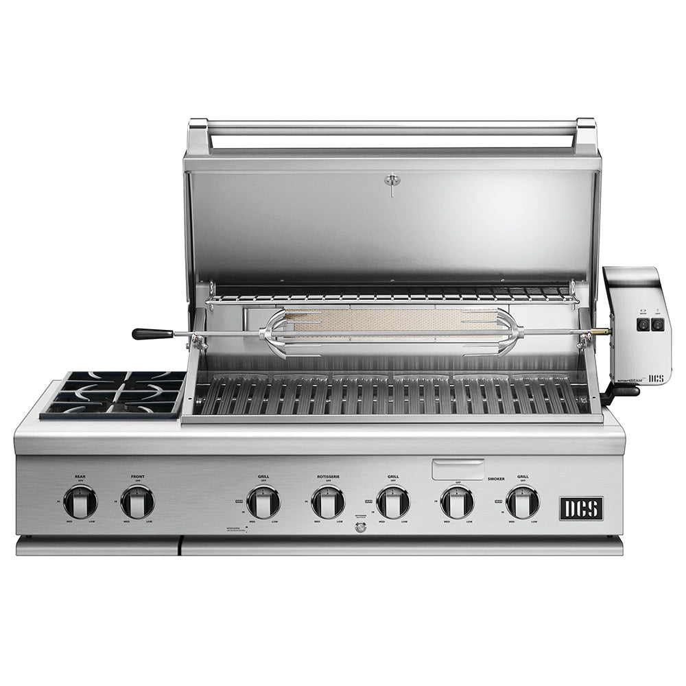 Built-in gas grill with open lid, cooking grates, and side burner controls
