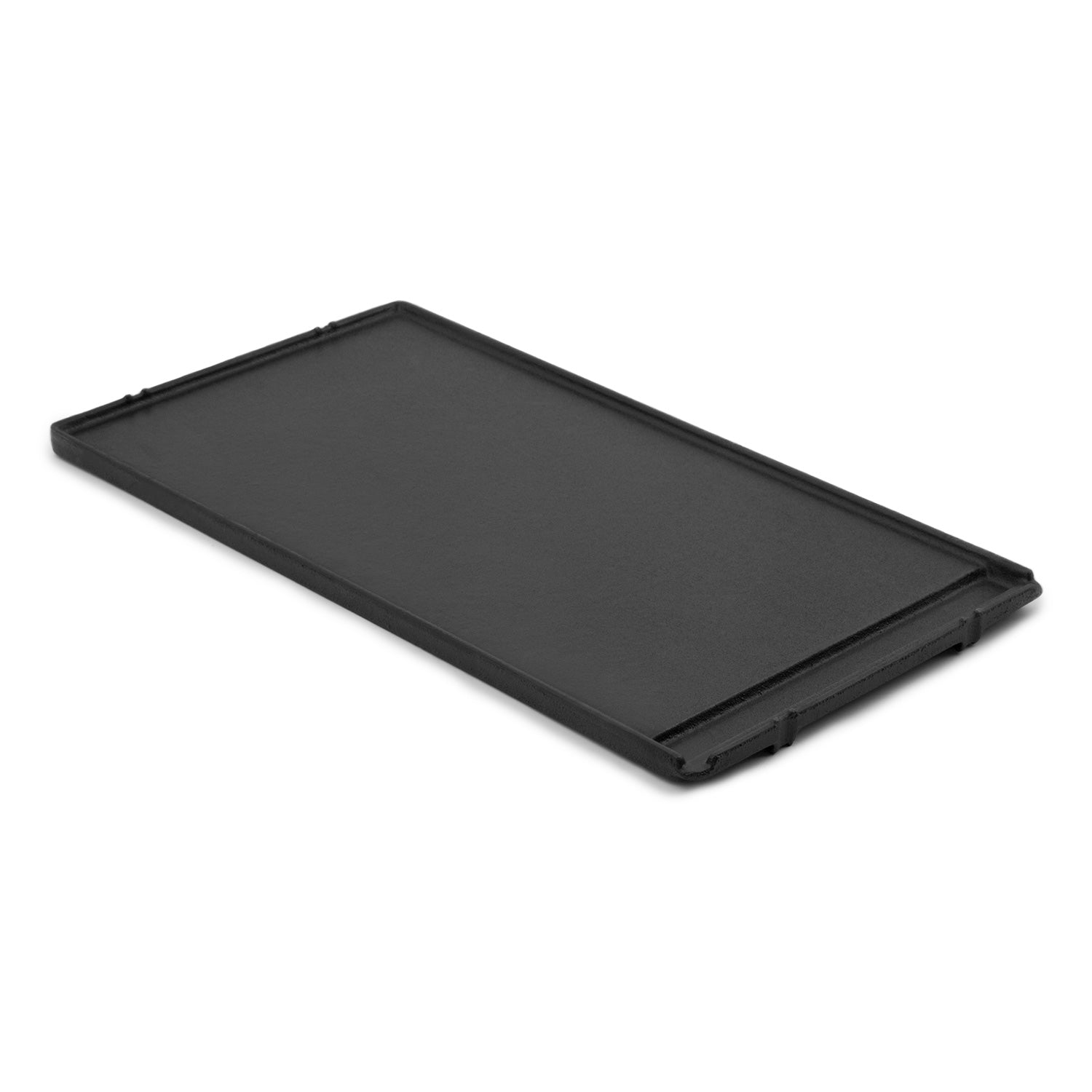 Black cast iron griddle with smooth flat cooking surface and side handles