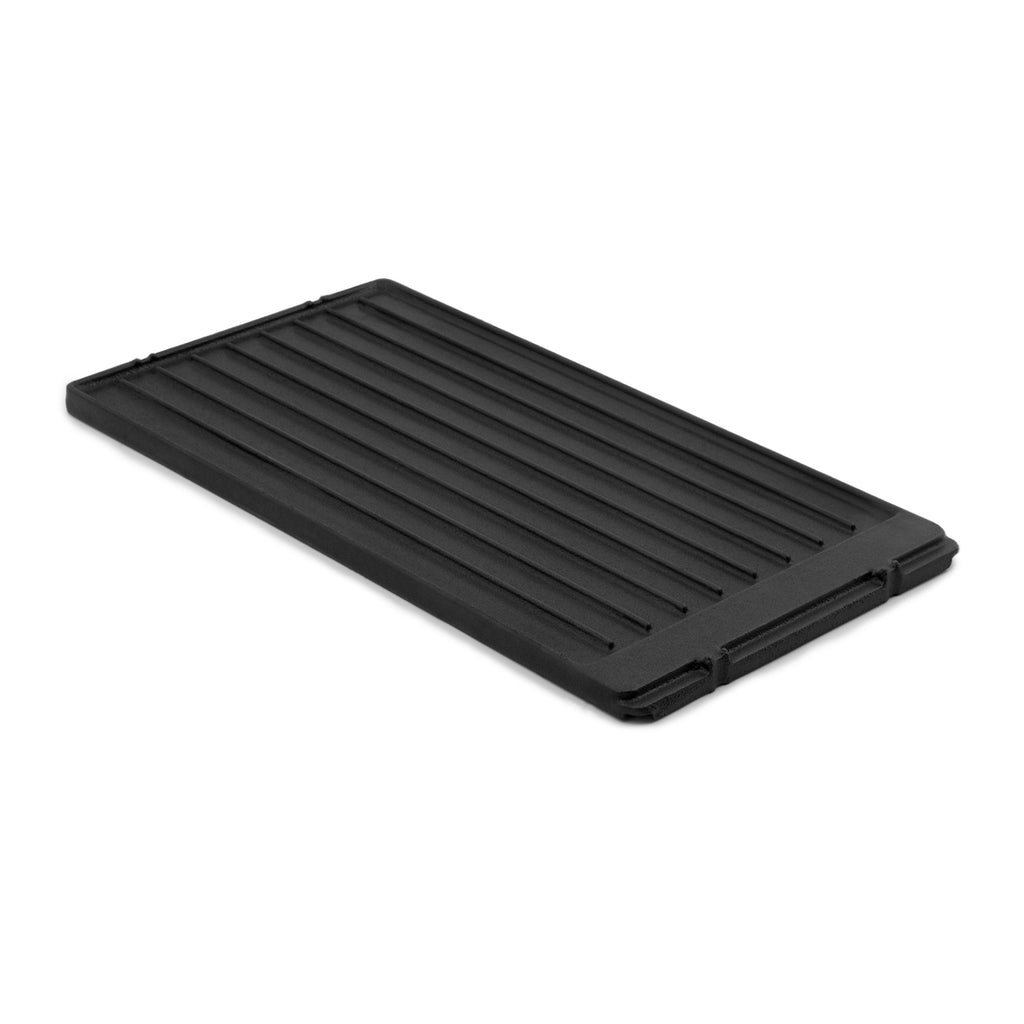 Black cast iron griddle with ridged cooking surface and side handles