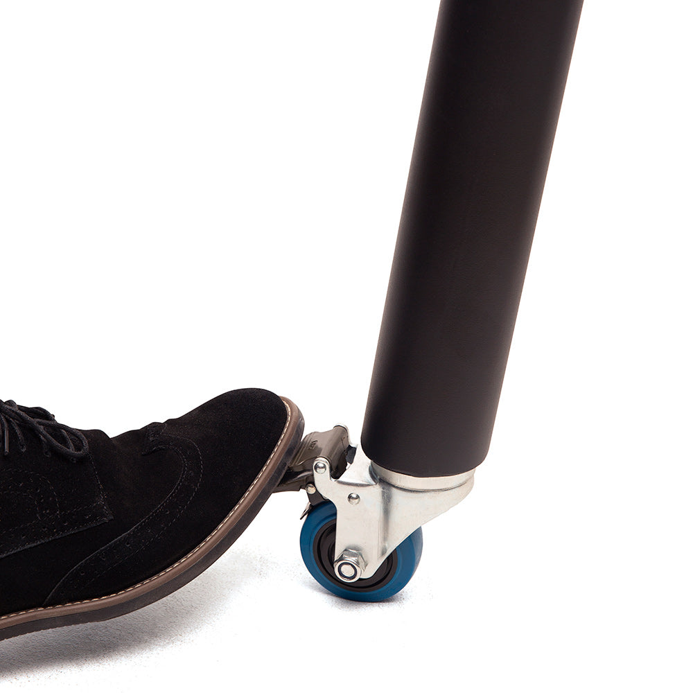 Pellet smoker grill wheel with a foot pushing it forward