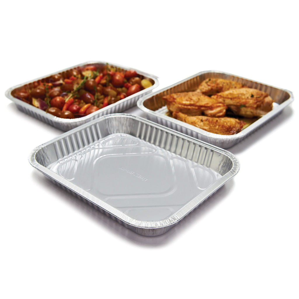 Aluminum drip pan set with three foil trays, one with grilled food inside