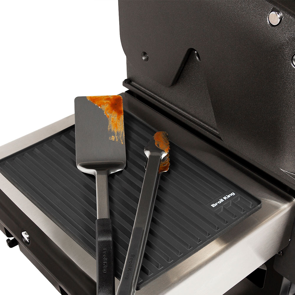 Broil King silicone side shelf mat on grill, black ribbed tray for accessories