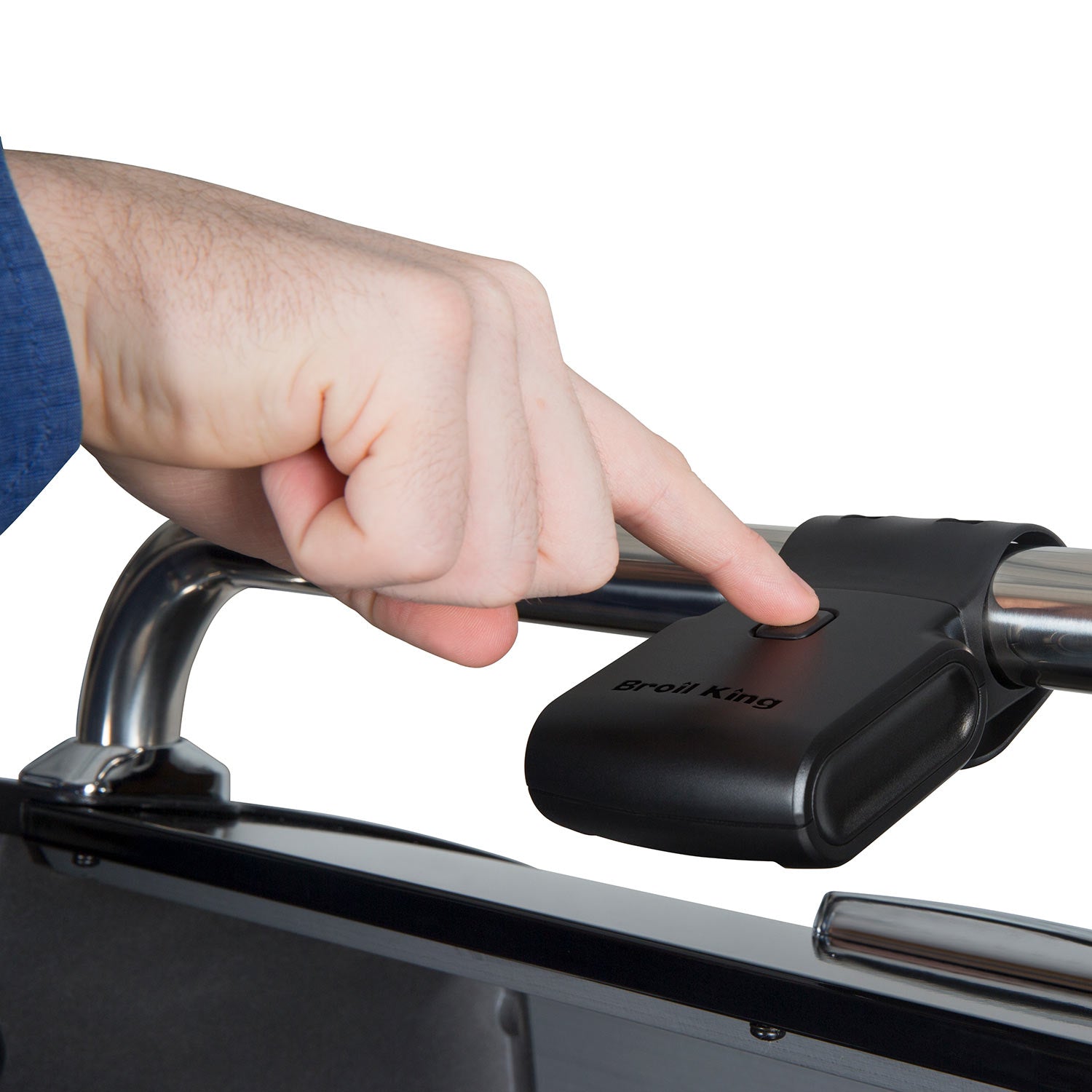 Hand securing a black grill light onto a grill handlebar using the clamp