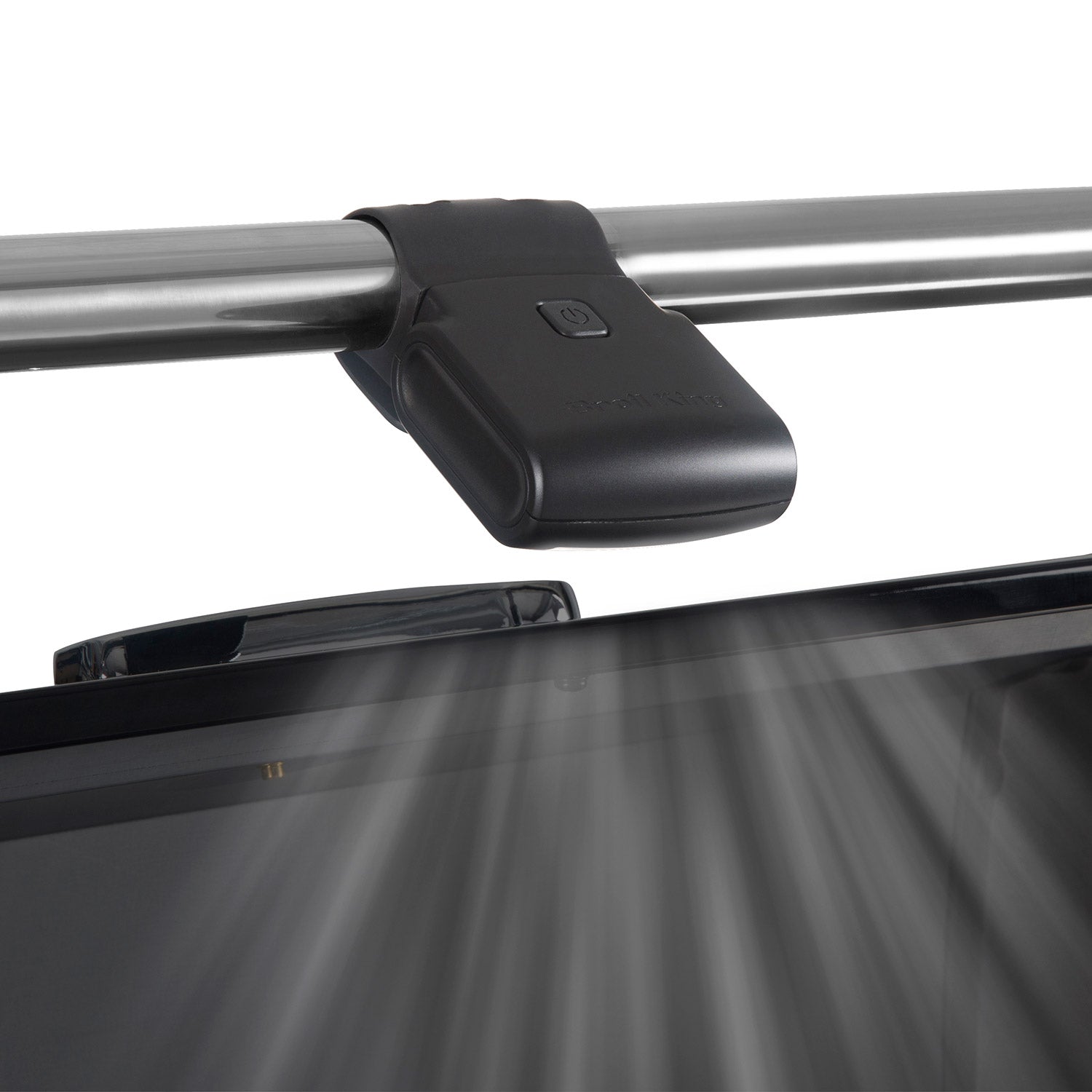 Black grill light clamped to a metal grill tube with lens facing the cooking surface