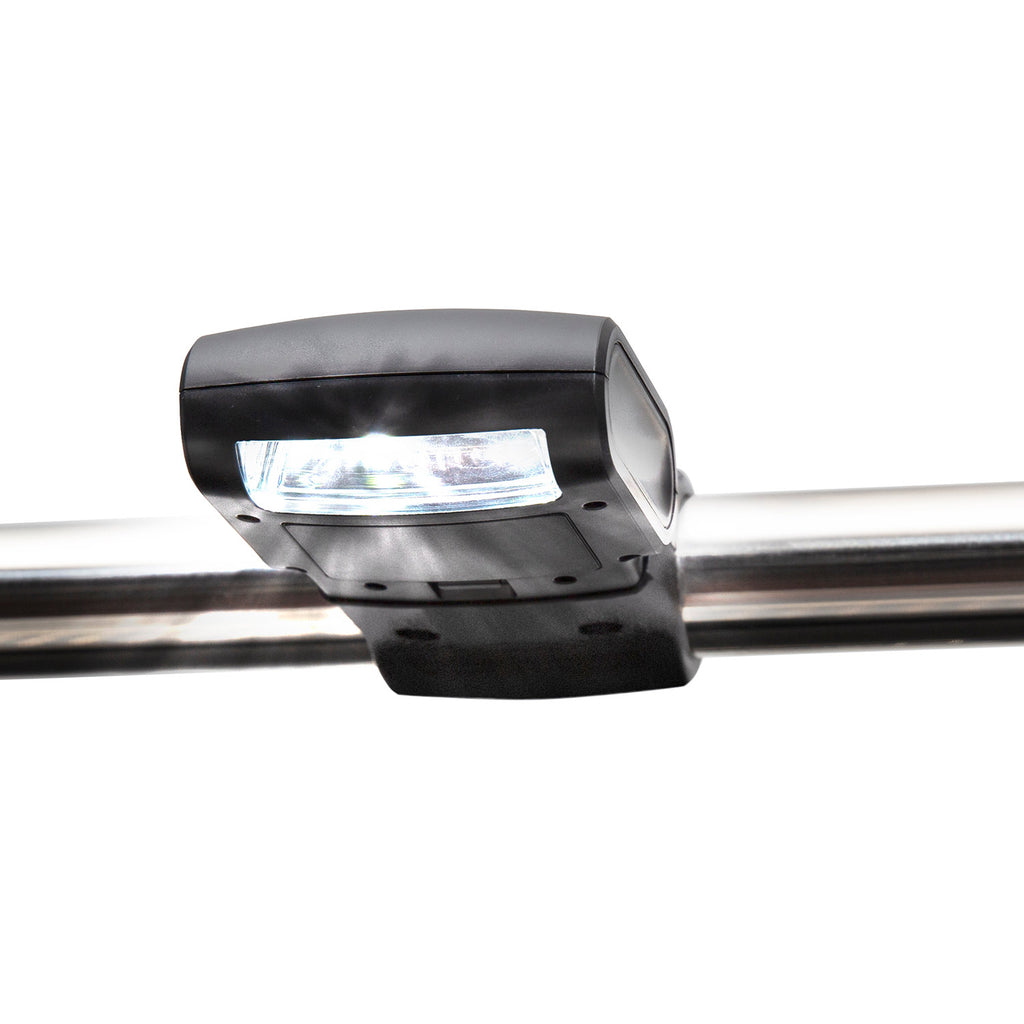 Handle-mounted grill light clipped to metal handle with bright LED