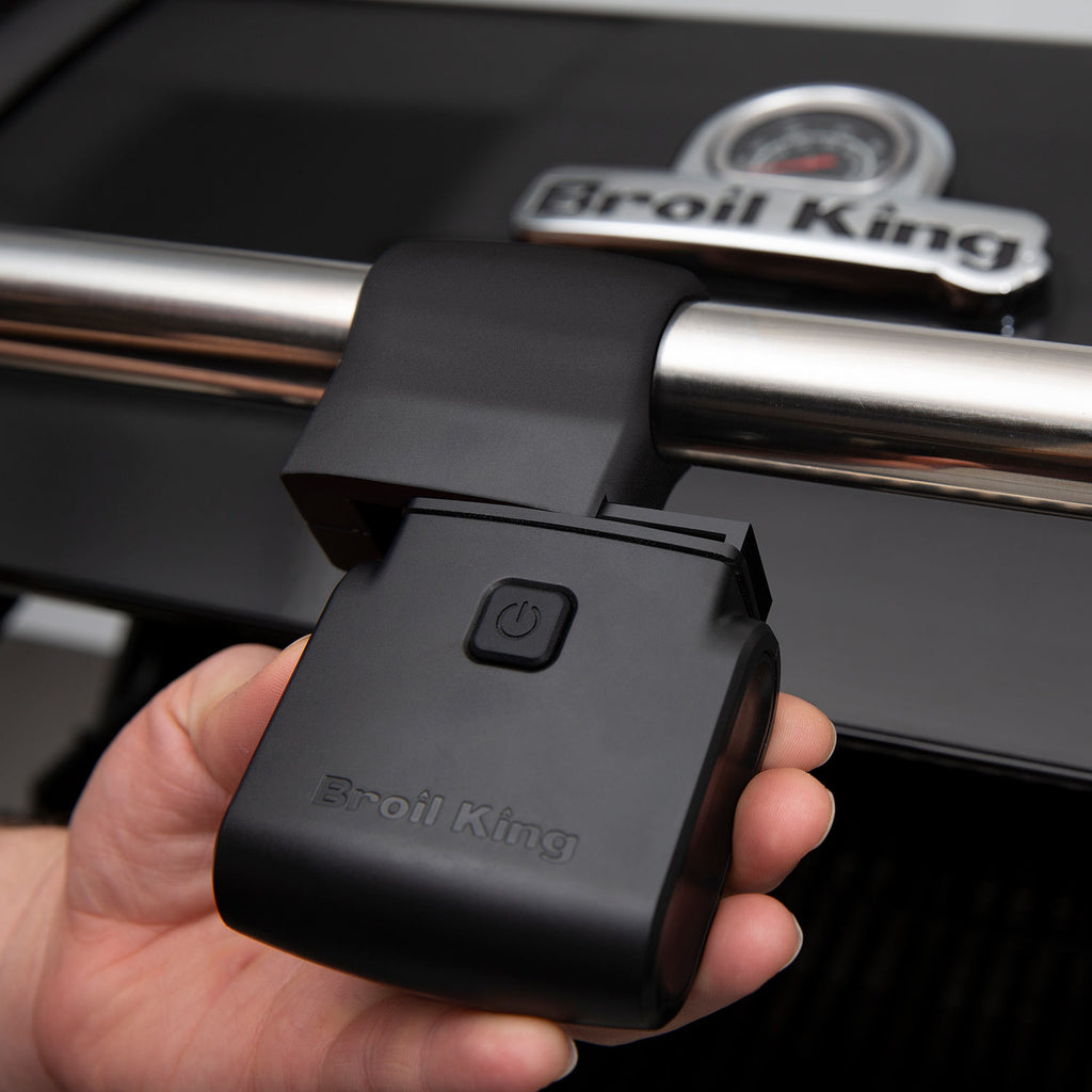 Broil King handle-mounted grill light with power button on black housing