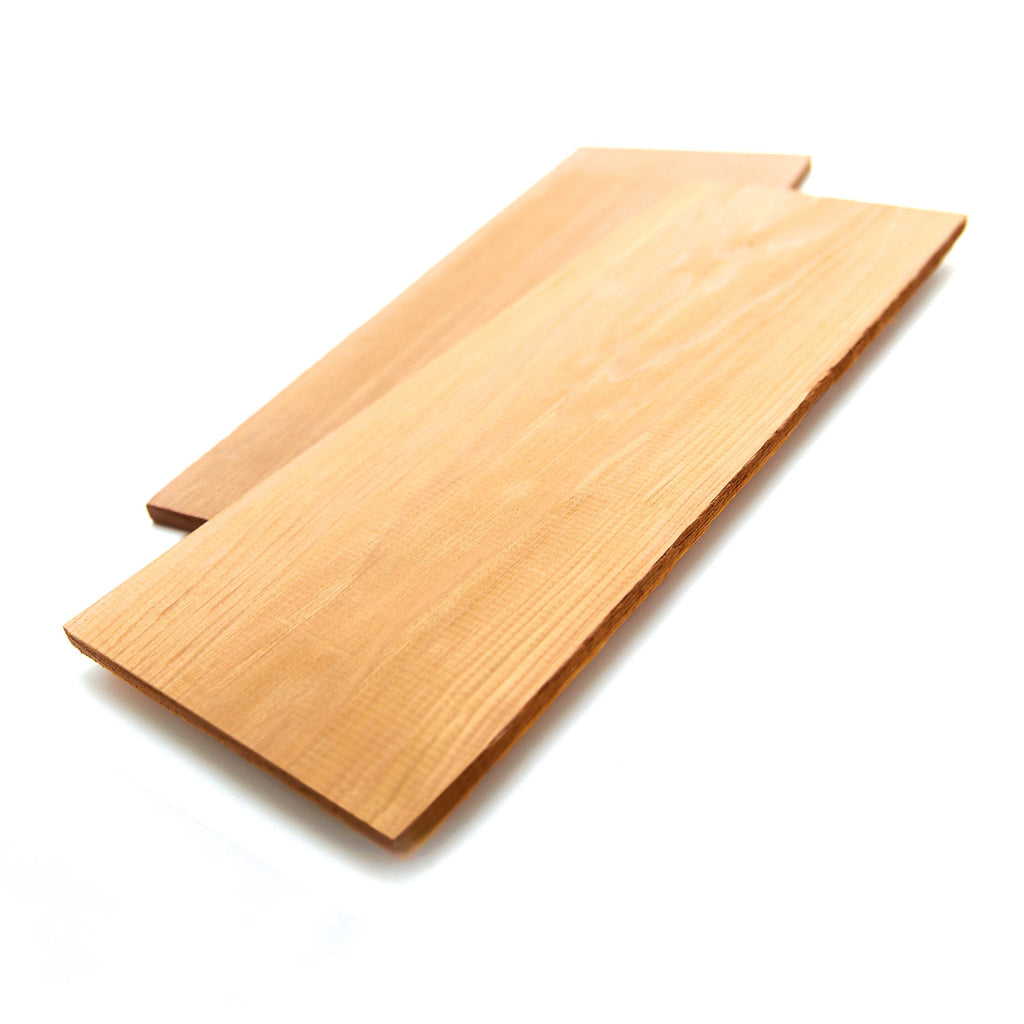 Cedar grilling planks with natural light wood boards, stacked and ready to use
