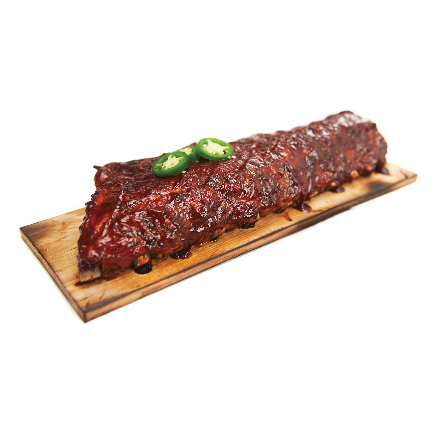 Maple grilling plank with grilled meat and jalapeño slices