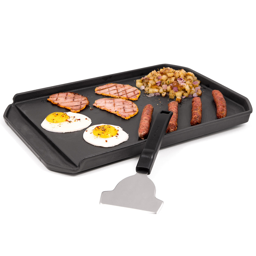 Griddle scraper with angled metal blade and black grip handle