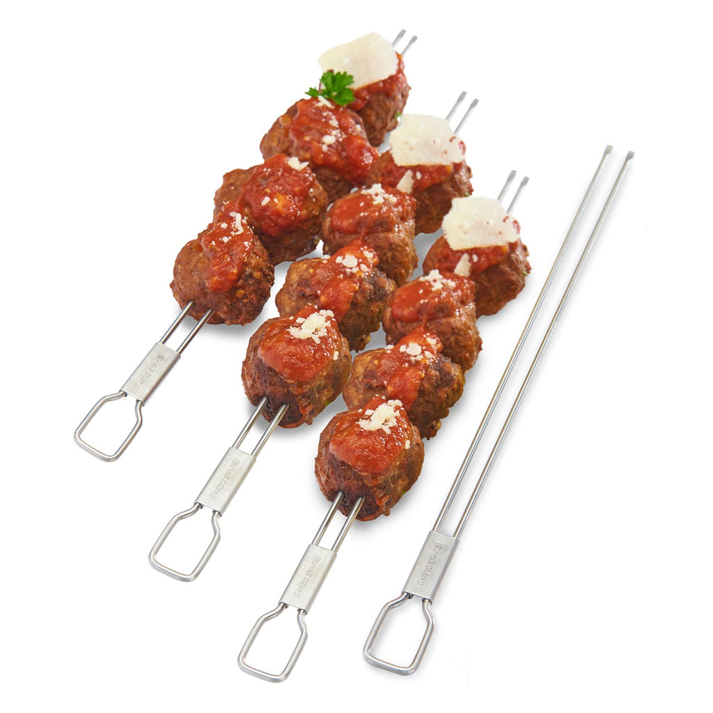 Stainless steel dual-prong skewers holding meatballs and onions, set of four